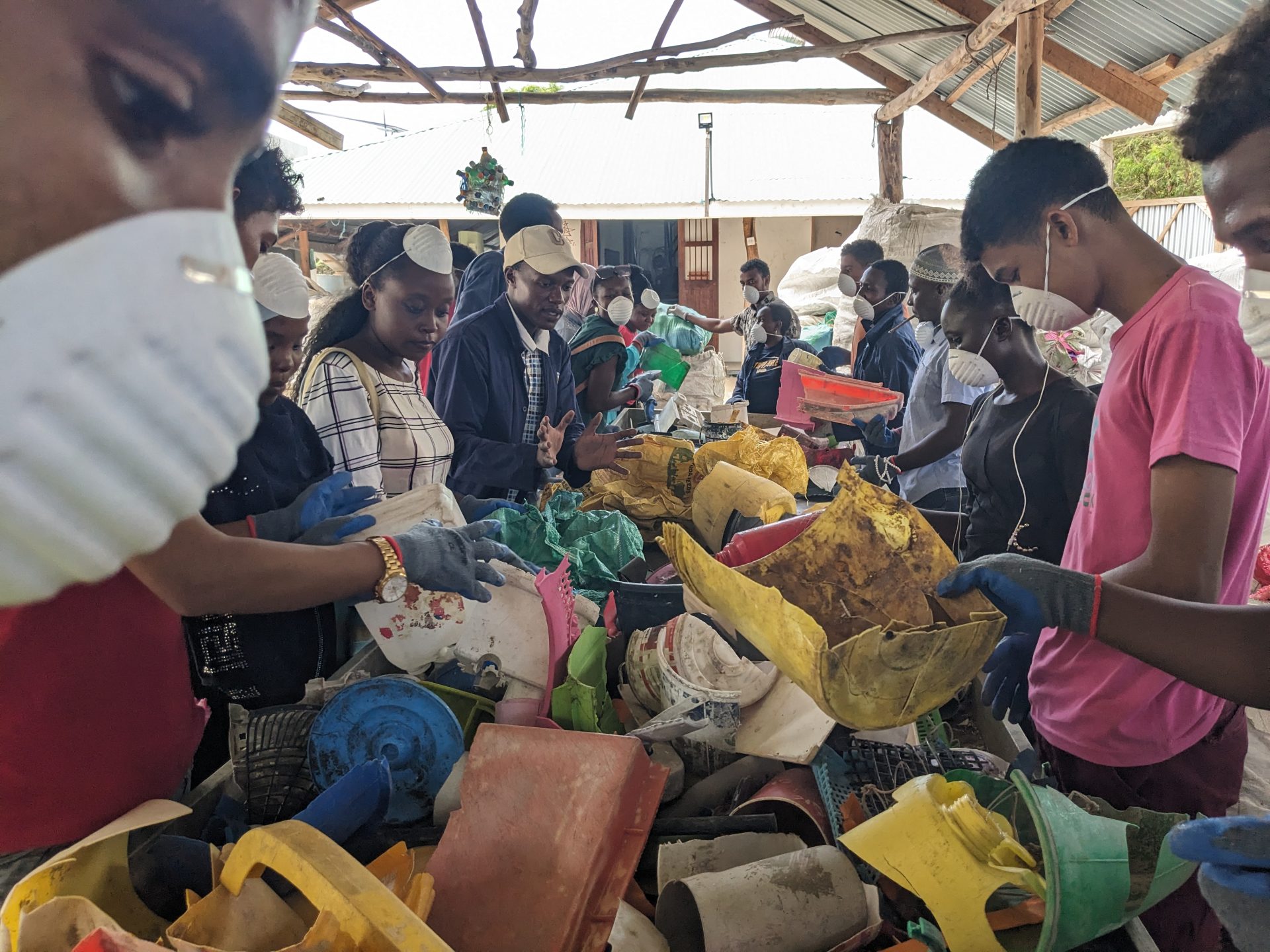 Team sorting through degraded plastics
